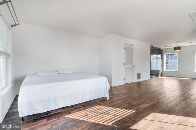 bedroom featuring dark hardwood / wood-style flooring