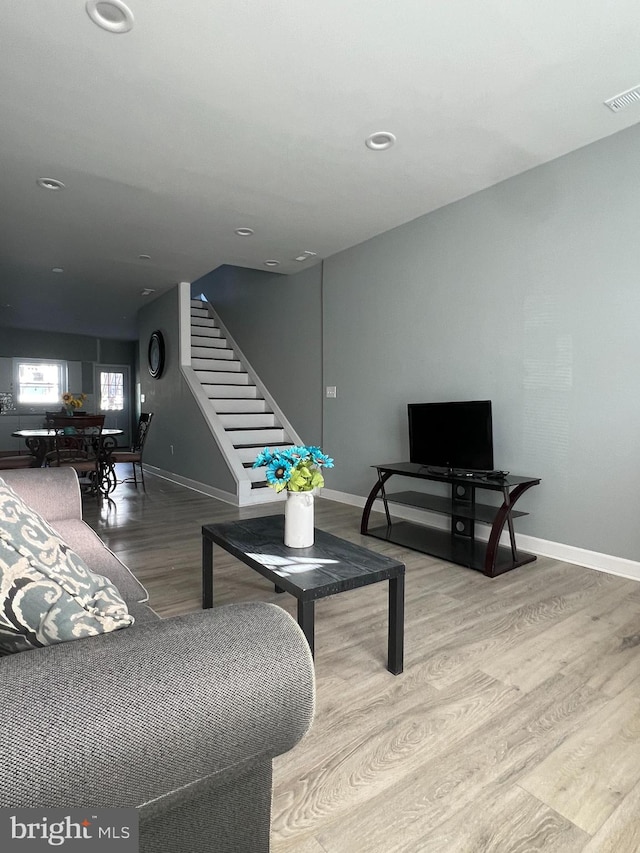 living room with light hardwood / wood-style flooring