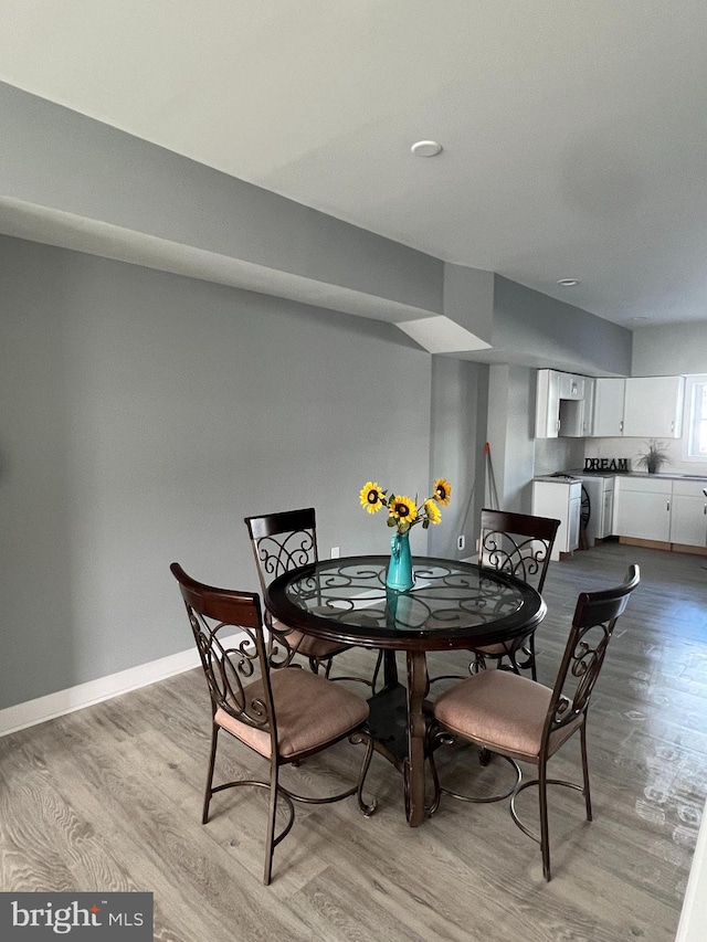 dining space featuring light hardwood / wood-style flooring