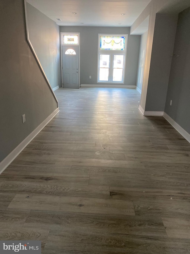 foyer entrance with dark hardwood / wood-style floors