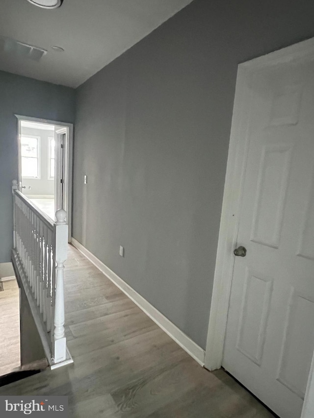 hallway with light wood-type flooring