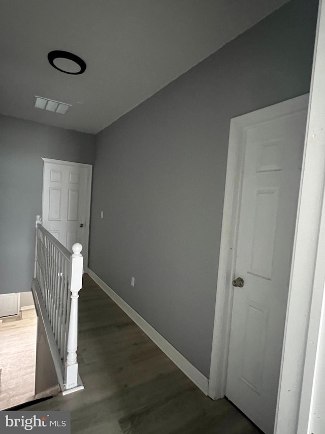 hallway featuring dark wood-type flooring