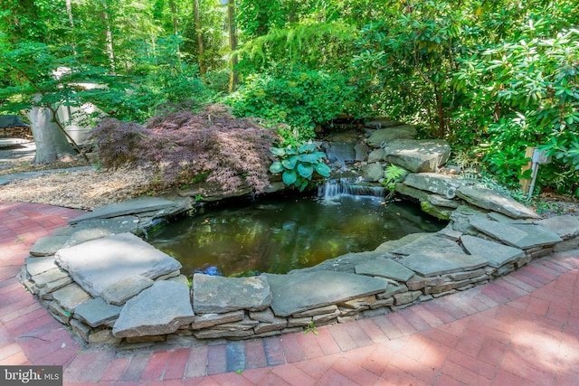 exterior details featuring a small pond