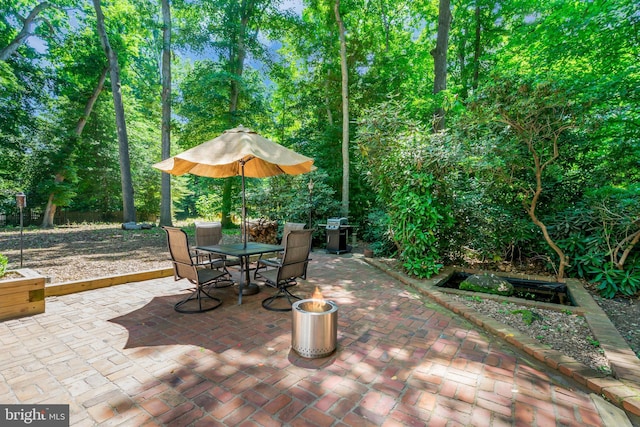 view of patio featuring a grill