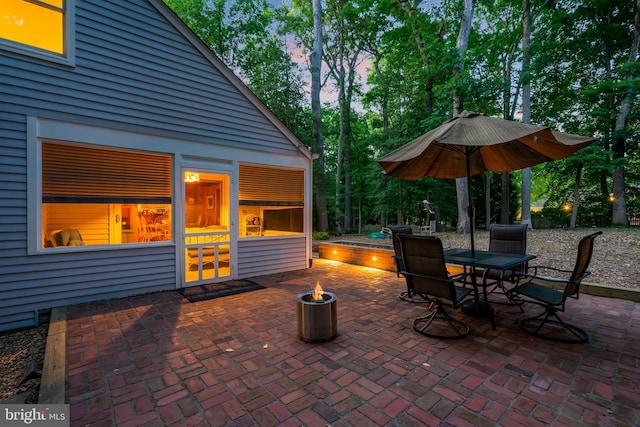 view of patio terrace at dusk