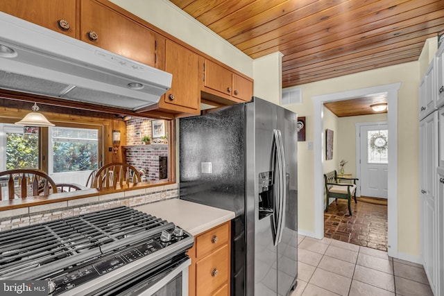 kitchen with light tile patterned flooring, backsplash, stainless steel fridge with ice dispenser, and wooden ceiling