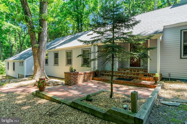 rear view of house featuring a patio area