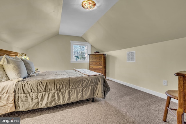 bedroom with lofted ceiling and carpet