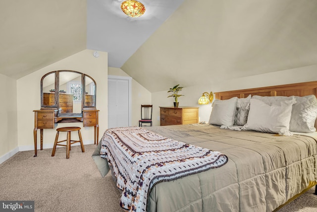 carpeted bedroom featuring vaulted ceiling