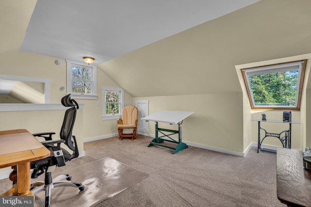 carpeted office space with lofted ceiling