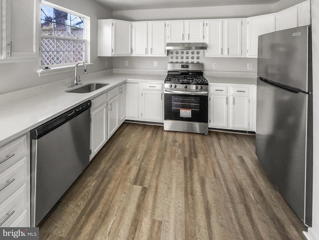 kitchen with sink, stainless steel appliances, and white cabinets