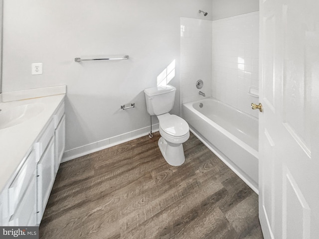 full bathroom with vanity, toilet, bathing tub / shower combination, and hardwood / wood-style floors