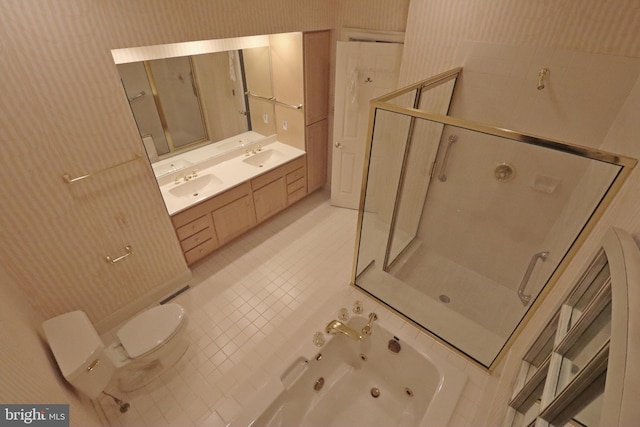 bathroom featuring vanity, tile patterned floors, toilet, and a shower