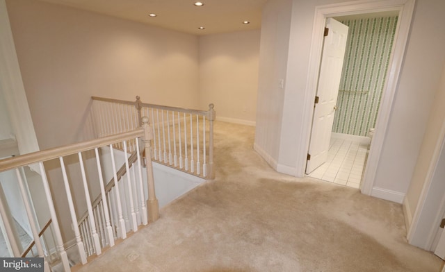 corridor with light colored carpet