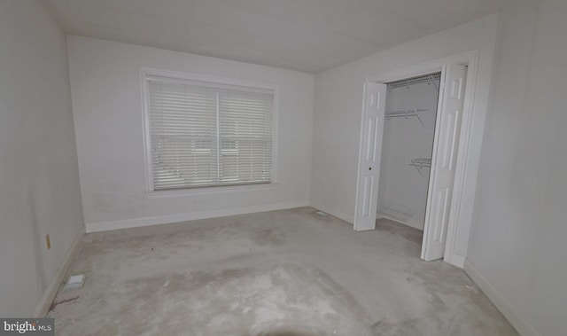 unfurnished bedroom with a closet