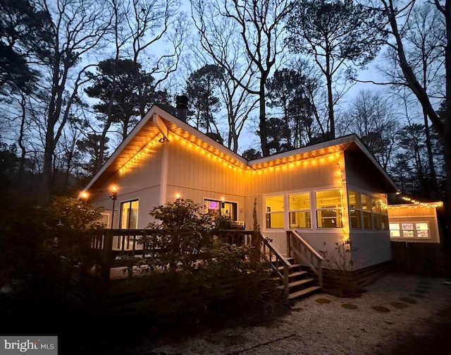 back of property featuring a sunroom