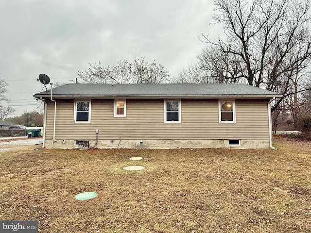 view of side of property with a yard