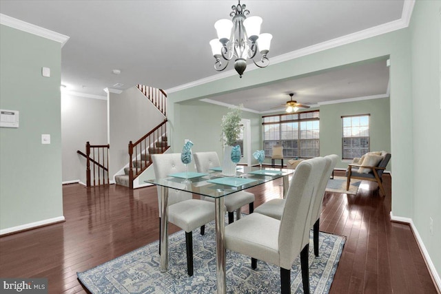 dining space with ornamental molding, dark hardwood / wood-style floors, and ceiling fan with notable chandelier