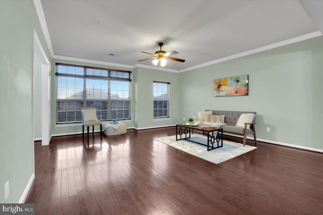 living room with ceiling fan, ornamental molding, and dark hardwood / wood-style flooring