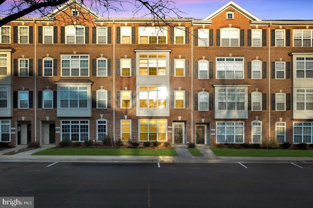 view of outdoor building at dusk