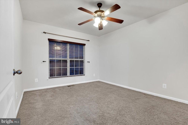 carpeted empty room with ceiling fan