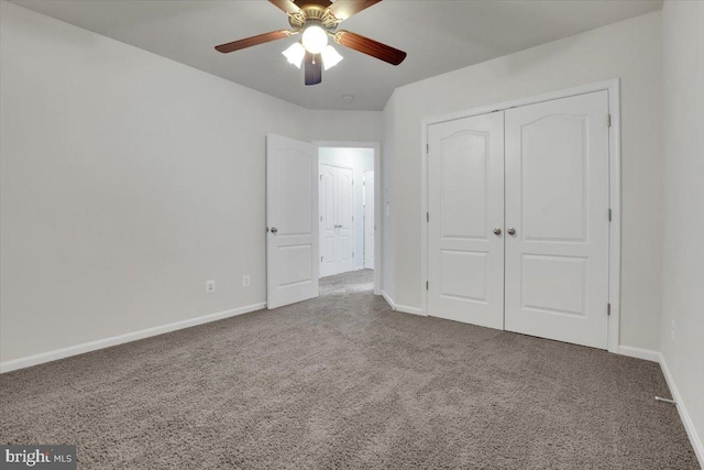 unfurnished bedroom with a closet, ceiling fan, and carpet flooring