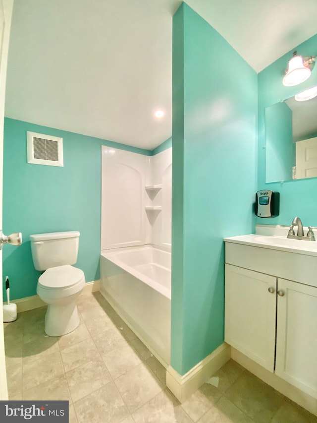 bathroom with toilet, vanity, a bath, and tile patterned flooring