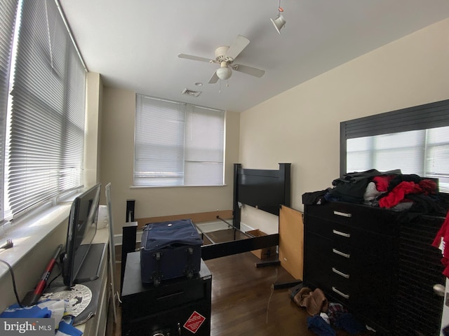 office area featuring lofted ceiling, dark hardwood / wood-style floors, and ceiling fan