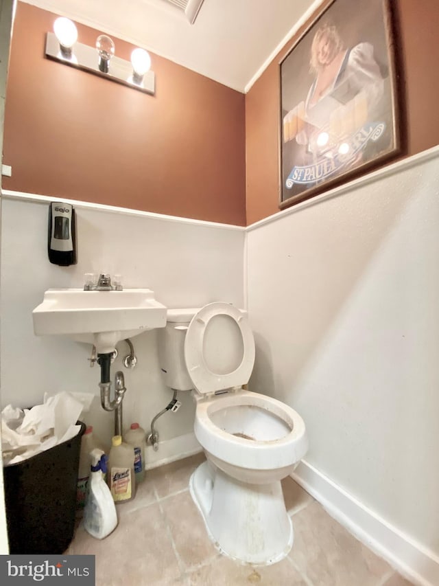 bathroom featuring tile patterned floors and toilet