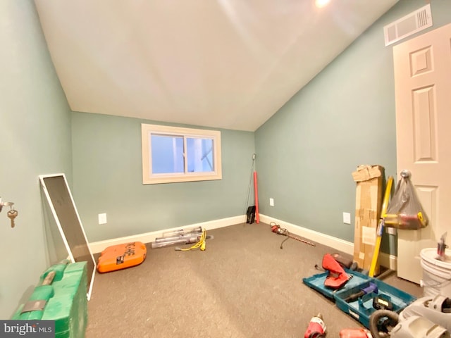 rec room featuring lofted ceiling and carpet flooring