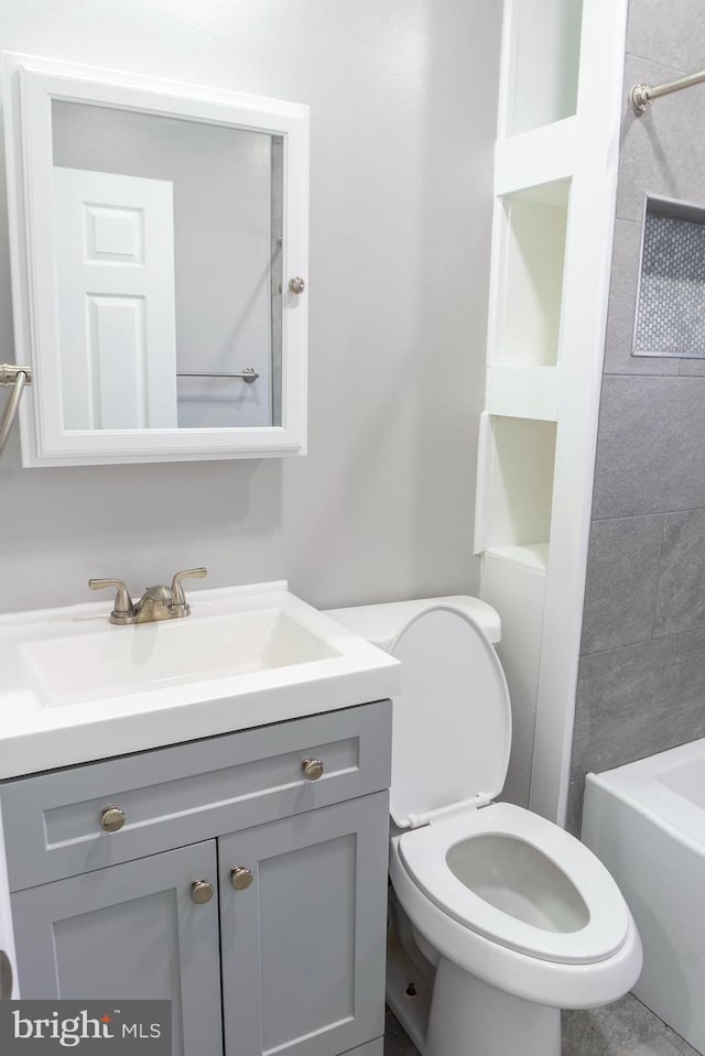 bathroom with vanity and toilet