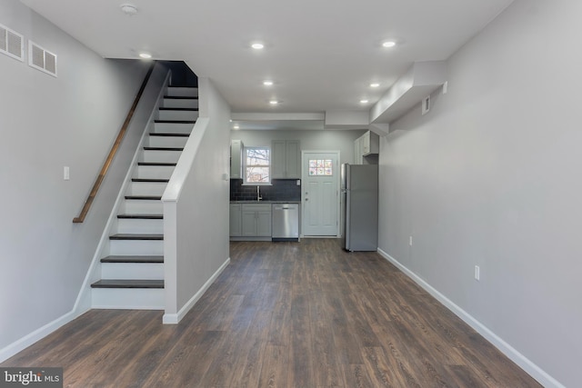 interior space featuring dark wood-type flooring and sink