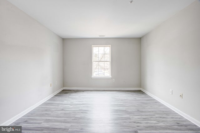 unfurnished room featuring light wood-type flooring