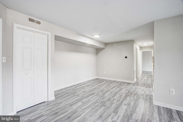 basement featuring light hardwood / wood-style flooring