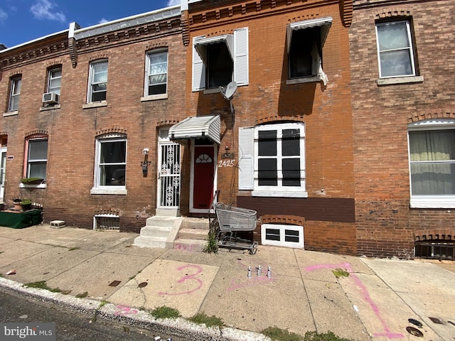 townhome / multi-family property featuring cooling unit and a patio area