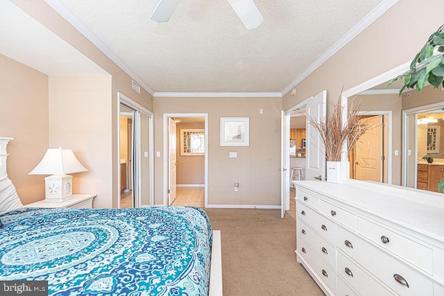 bedroom featuring ceiling fan, ensuite bathroom, ornamental molding, a textured ceiling, and light carpet