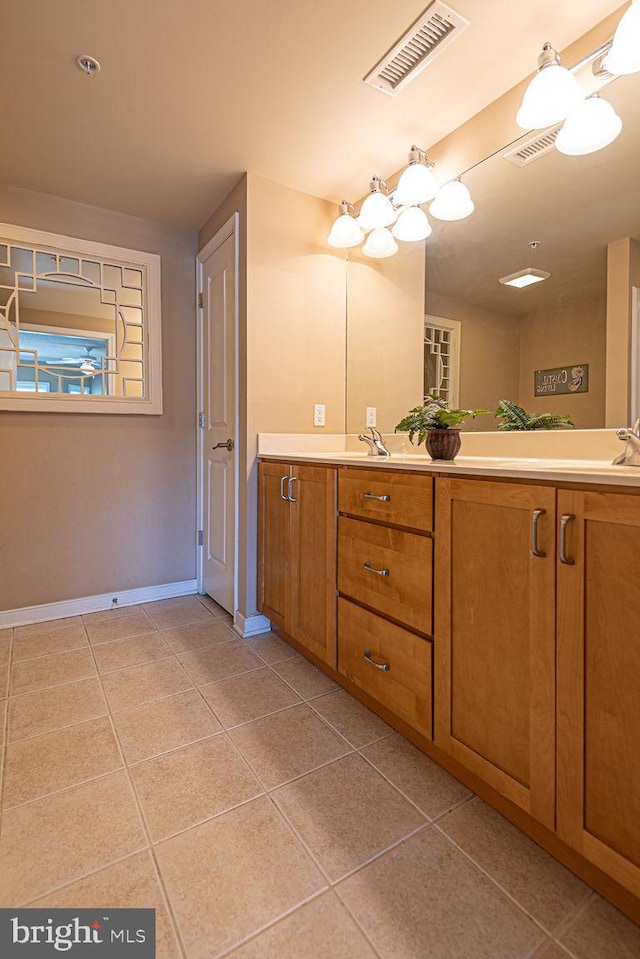 bathroom with tile patterned floors and vanity