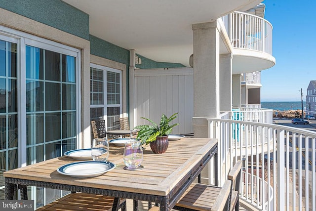 balcony featuring a water view