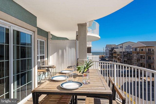 balcony featuring a water view