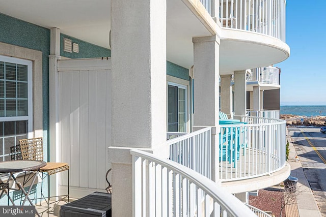 balcony featuring a water view