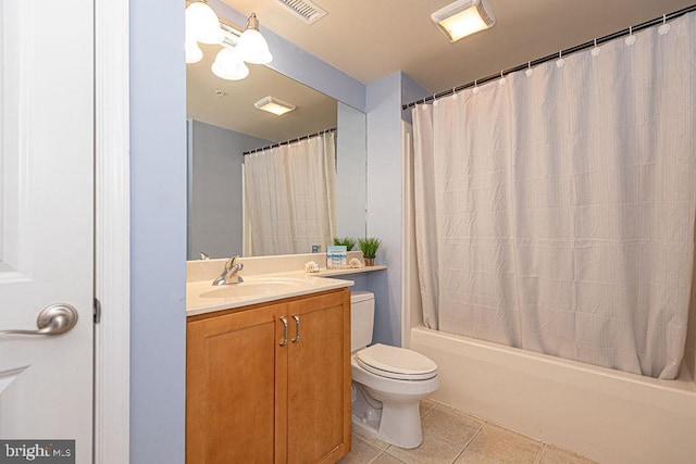 full bathroom featuring tile patterned floors, toilet, shower / bath combo with shower curtain, and vanity