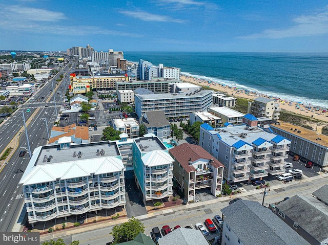 bird's eye view featuring a water view and a view of the beach