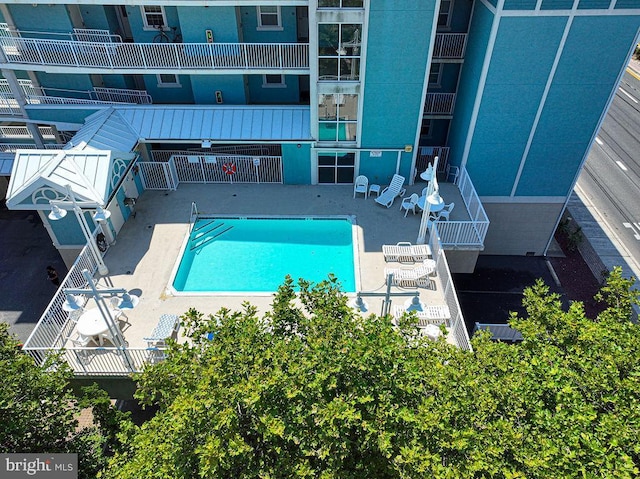 view of swimming pool featuring a patio