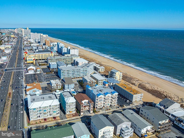 aerial view featuring a water view and a beach view