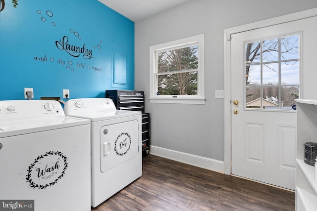 laundry area featuring plenty of natural light, dark hardwood / wood-style flooring, and washer and dryer