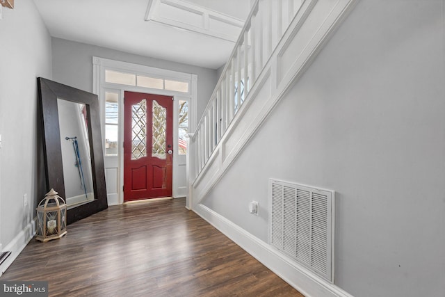 foyer with dark hardwood / wood-style flooring