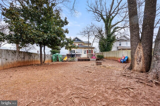 view of yard with a wooden deck