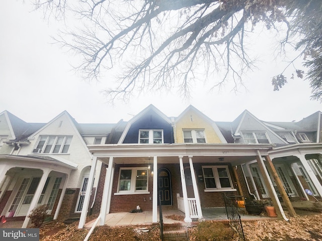 view of property featuring a porch