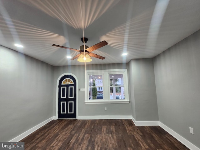 entrance foyer featuring dark hardwood / wood-style flooring and ceiling fan