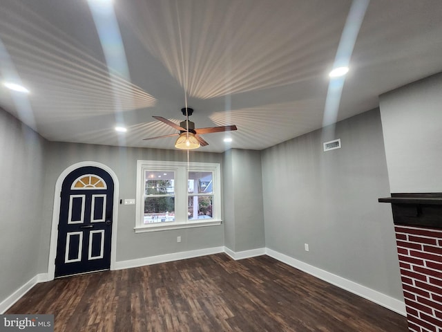 interior space featuring dark hardwood / wood-style floors and ceiling fan